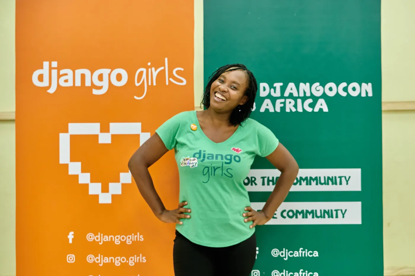 A smiling participant in a Django Girls shirt